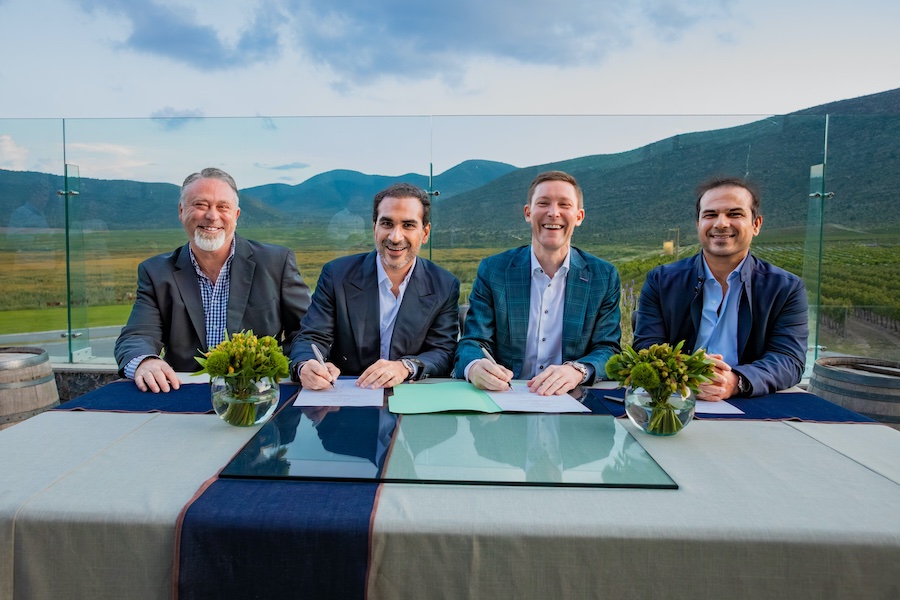 Cone Denim and Artistic Milliners leadership at signing ceremony. Left to right: Steve Maggard, Murtaza Ahmed, Jeffrey P Pritchett, Omer Ahmed. © 2025